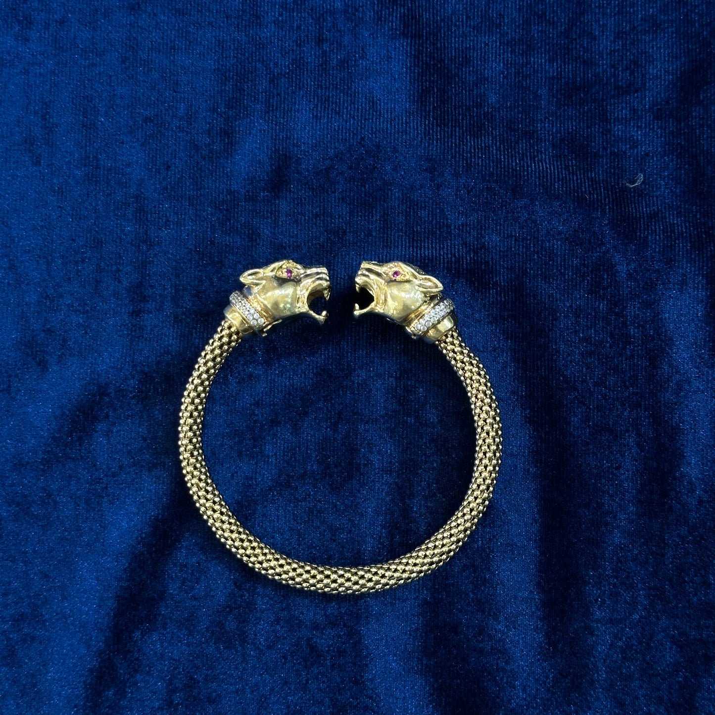 Bracciale pantera anni '60 in oro giallo, diamanti e rubini